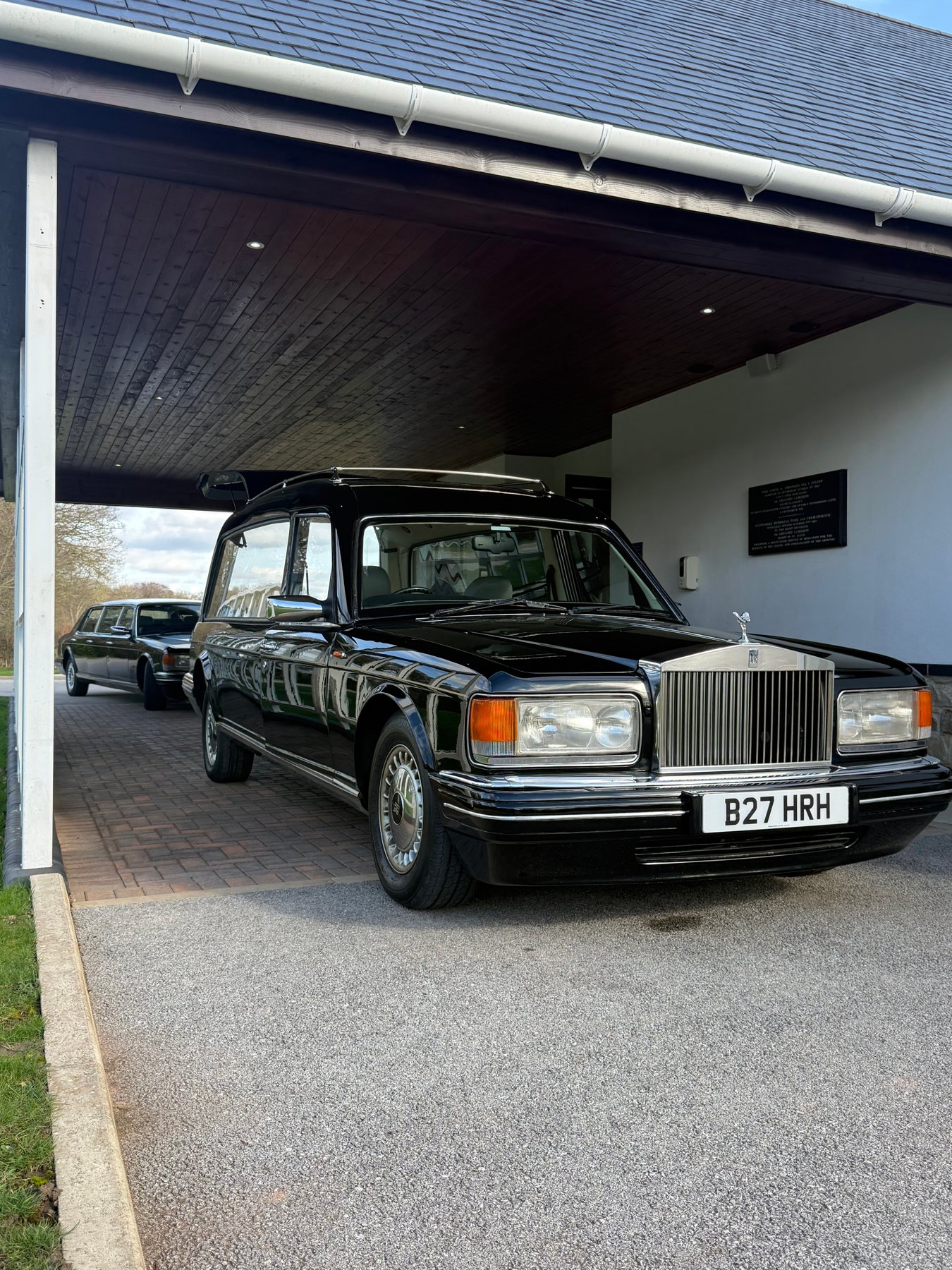 A Rolls Royce hearse beneath the porch at The White House